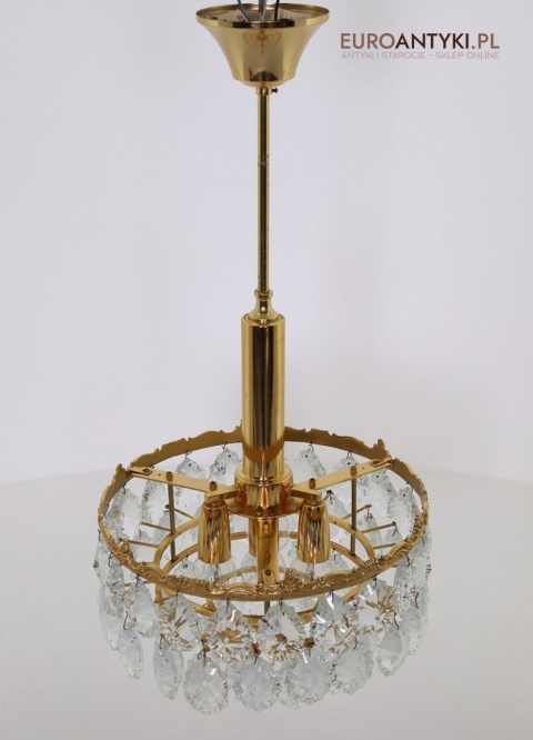 zabytkowy żyrandol kryształowy o pałacowym charakterze