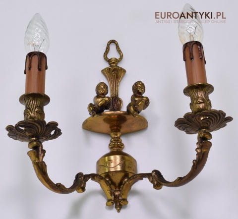 Zabytkowy kinkiet z cherubinkami lampka ścienna muzealna retro oświetlenie