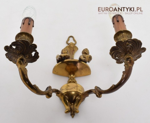 Zabytkowy kinkiet z cherubinkami lampka ścienna muzealna retro oświetlenie