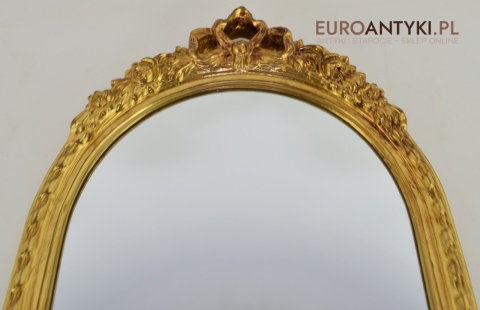Pałacowe lustro w złotej ramie. Sklep ze starociami.