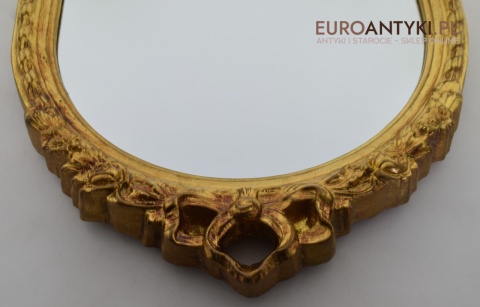 Pałacowe lustro w złotej ramie. Sklep ze starociami.