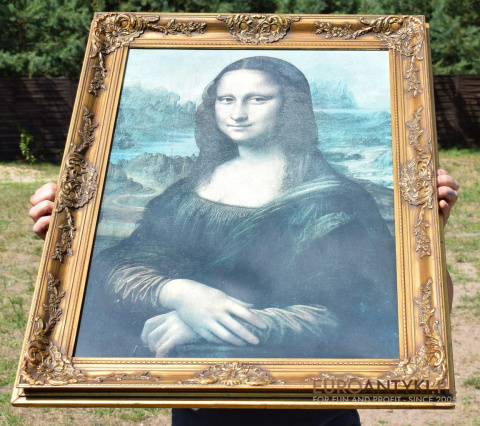 Mona Lisa stary obraz w złotych drewnianych ramach.